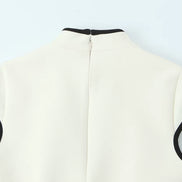 Élodine Damen Minikleid mit Kontrastdetails und Cut-out Design