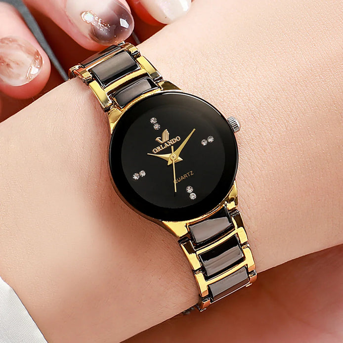 Damen Quarzuhr mit rundem Zifferblatt und Metallarmband