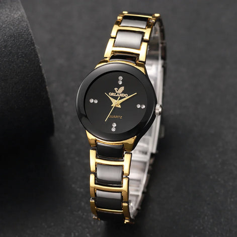 Damen Quarzuhr mit rundem Zifferblatt und Metallarmband